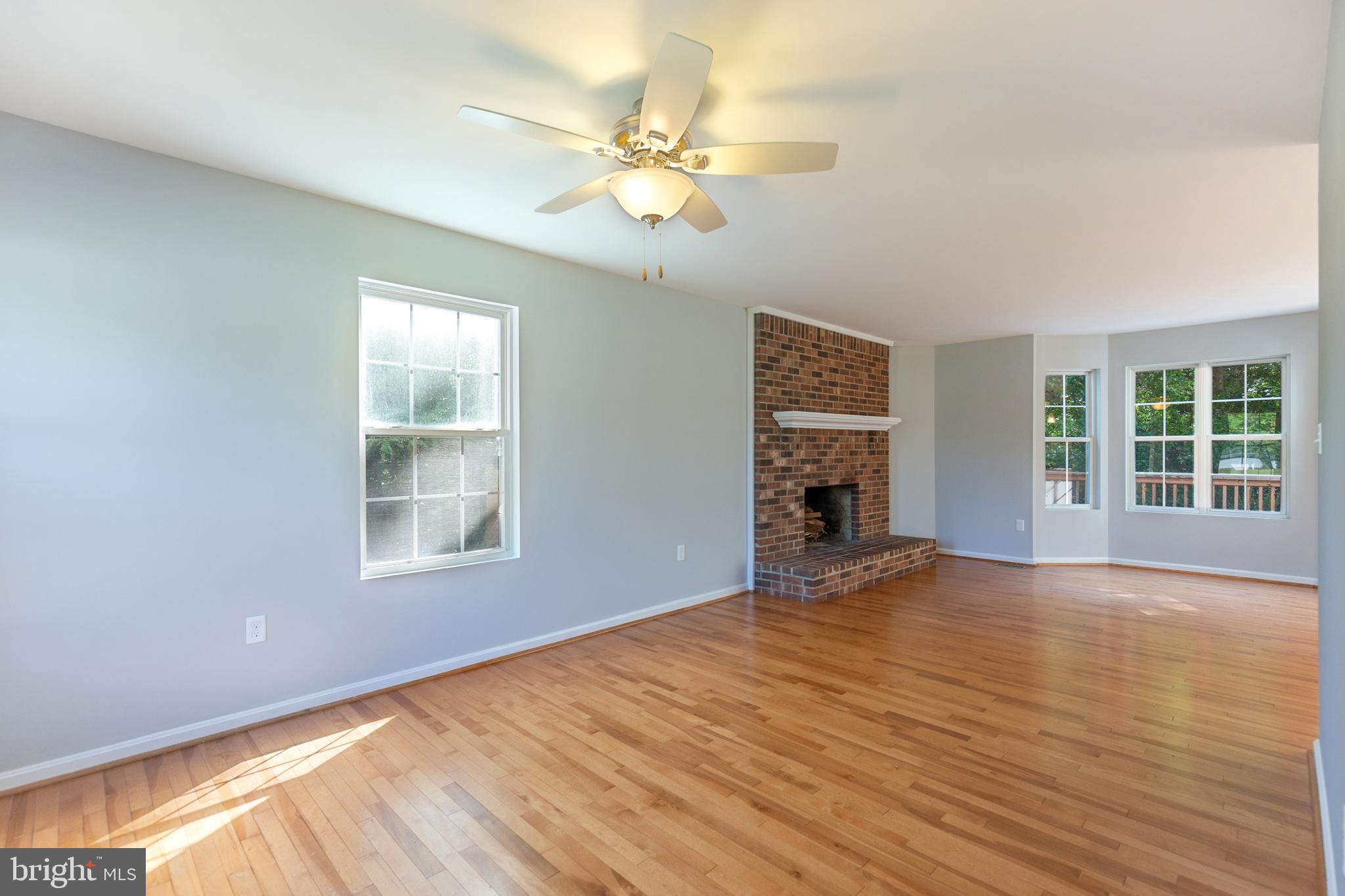 8140 Simpson Farm Road Owings, MD 20736 - Photo 4 of 31 View of FR wood fireplace from living room