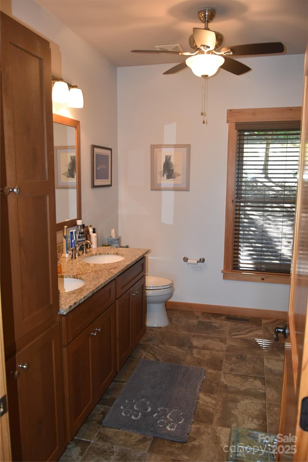 80 Grandview Loop Nebo, NC 28761 - Photo 24 of 42 a bathroom with a double vanity sink a toilet and a mirror