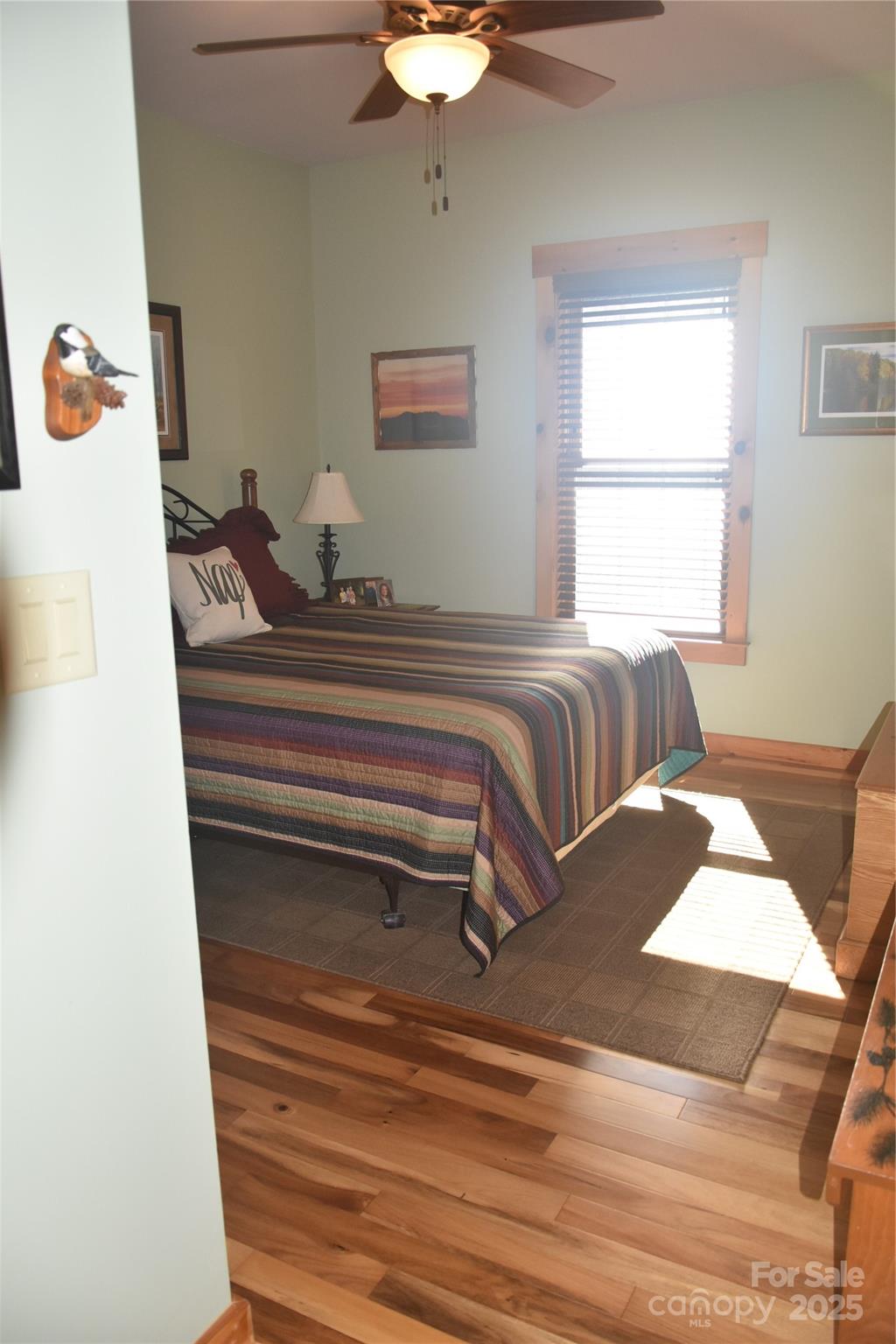 80 Grandview Loop Nebo, NC 28761 - Photo 27 of 42 a view of a bedroom with a bed and a chandelier