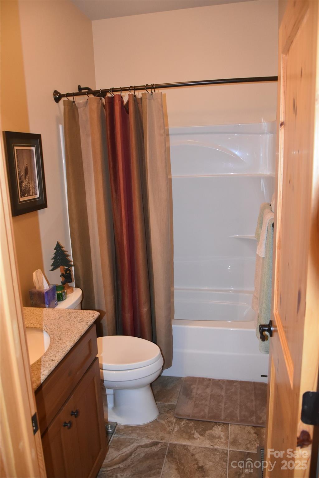 80 Grandview Loop Nebo, NC 28761 - Photo 28 of 42 a bathroom with a sink toilet and shower