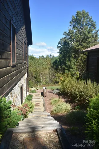 a view of a backyard with pathway