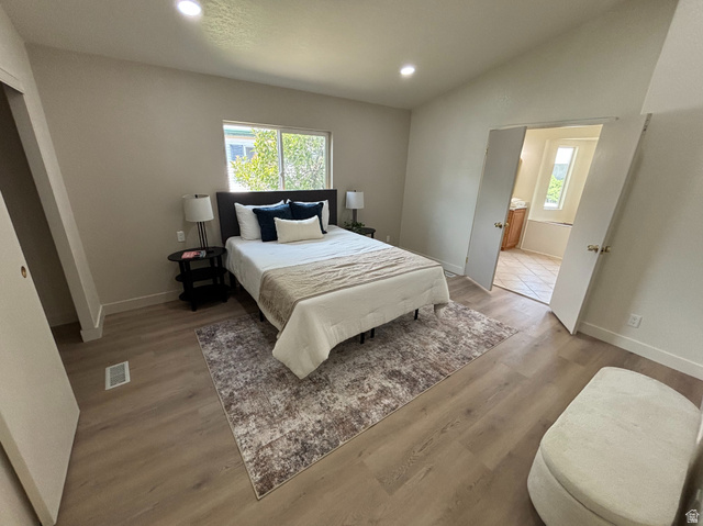 11313 South 265 East Sandy, UT 84070 - Photo 6 of 21 Spacious room featuring wood-finish flooring, recessed lighting, and a window with exterior views