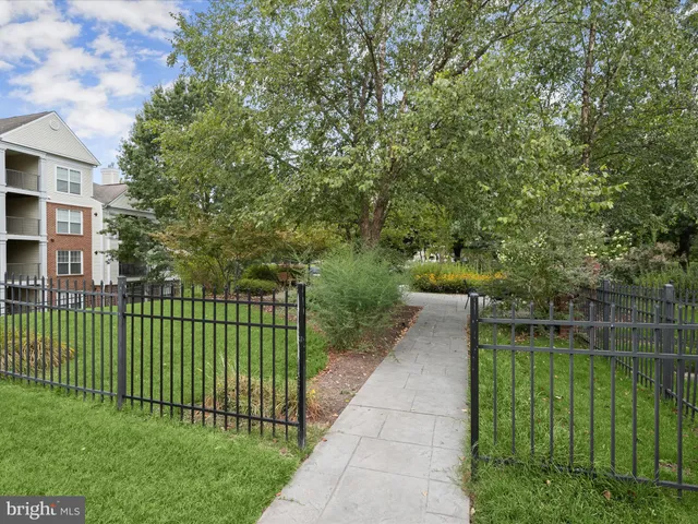 a view of a chairs and table in the garden