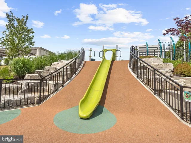 a view of a balcony and car parked