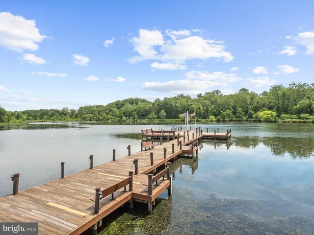a view of a swimming pool with outdoor seating
