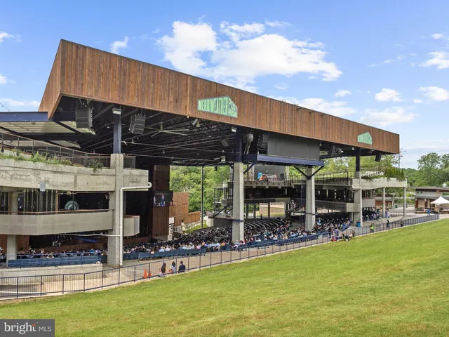 a view of a swimming pool with an outdoor seating