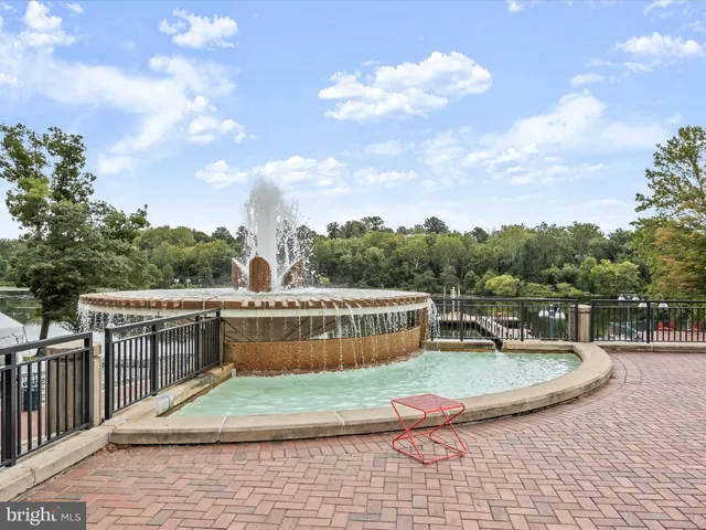 a picture of a bench in front of a wall