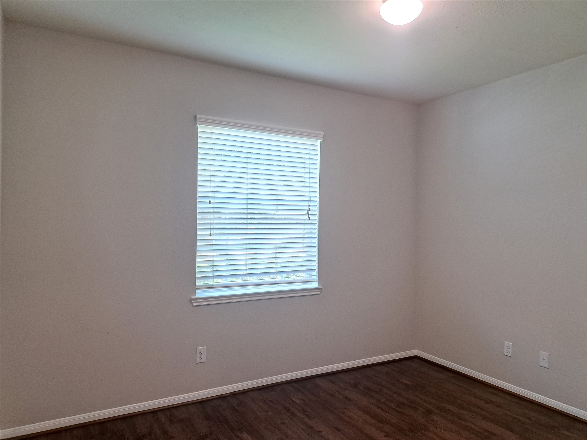 26315 Fox Ridge Lane Katy, TX 77494 - Photo 23 of 39 an empty room with wooden floor and a window