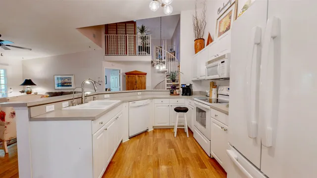a kitchen with stainless steel appliances a sink and cabinets