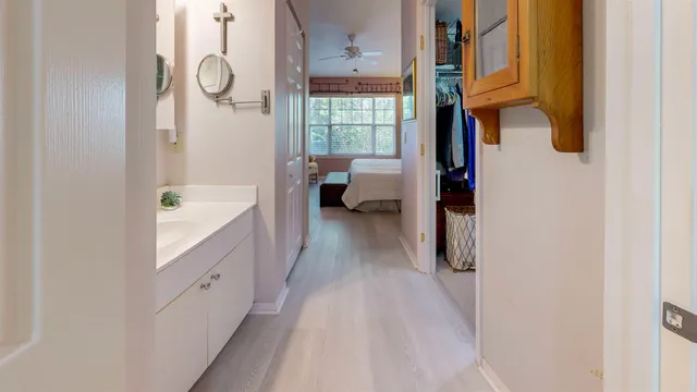 a bathroom with a sink mirror and shower