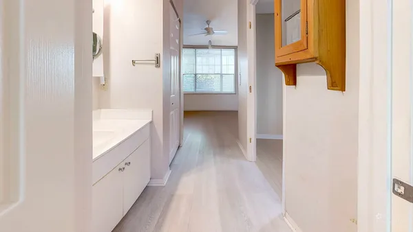 a white toilet sitting next to a bathroom sink