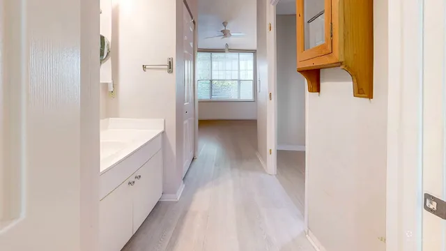 a white toilet sitting next to a bathroom sink