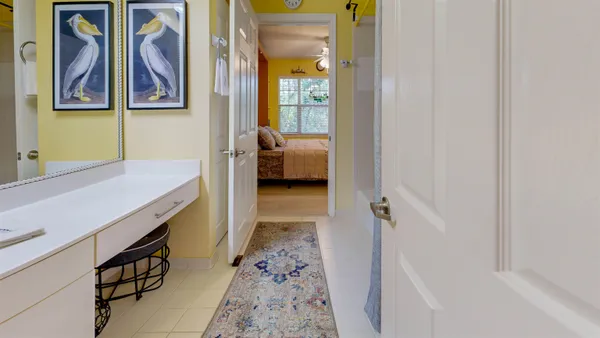a bedroom with furniture and a flat screen tv