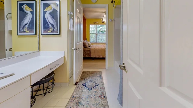 a bedroom with furniture and a flat screen tv