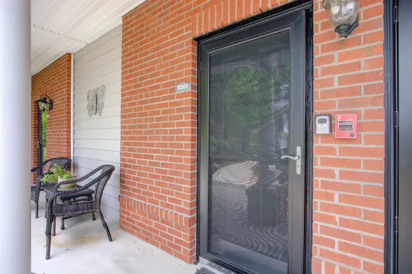 a bathroom with a shower and a mirror