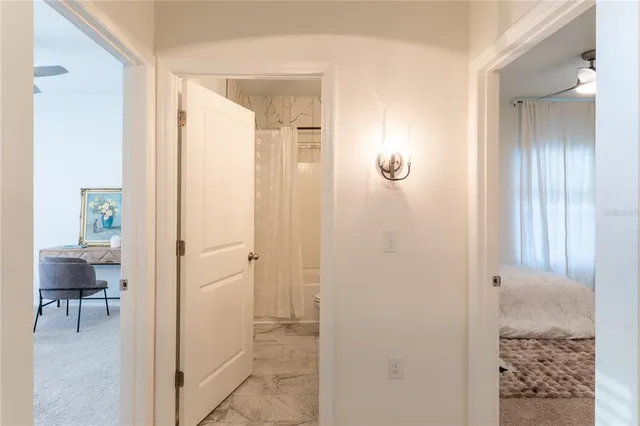 a view of a bathroom from a hallway