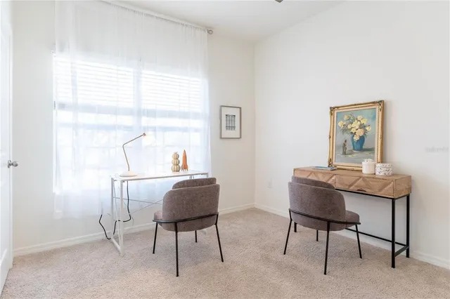 a workspace with furniture and a window