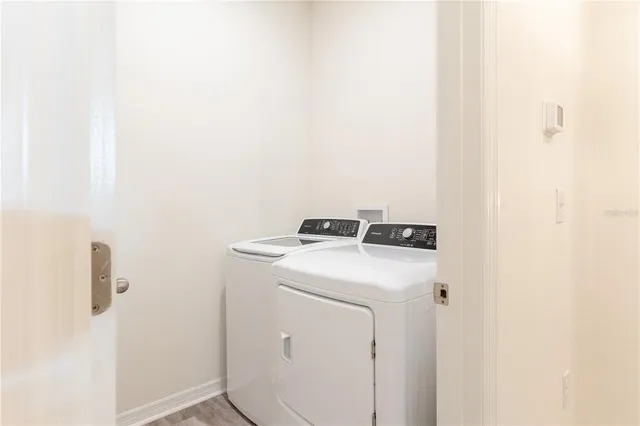 a utility room with dryer and washer