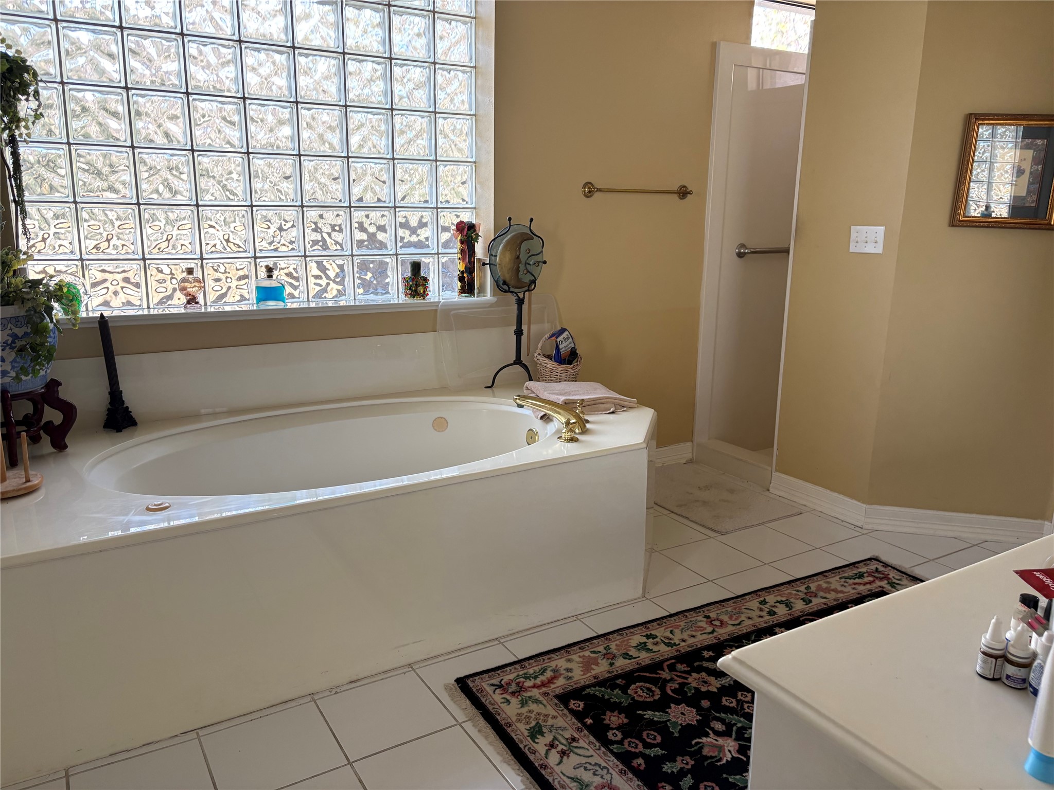 24602 West Kingscrest Circle Spring, TX 77389 - Photo 11 of 15 a bathroom with a bathtub and a window