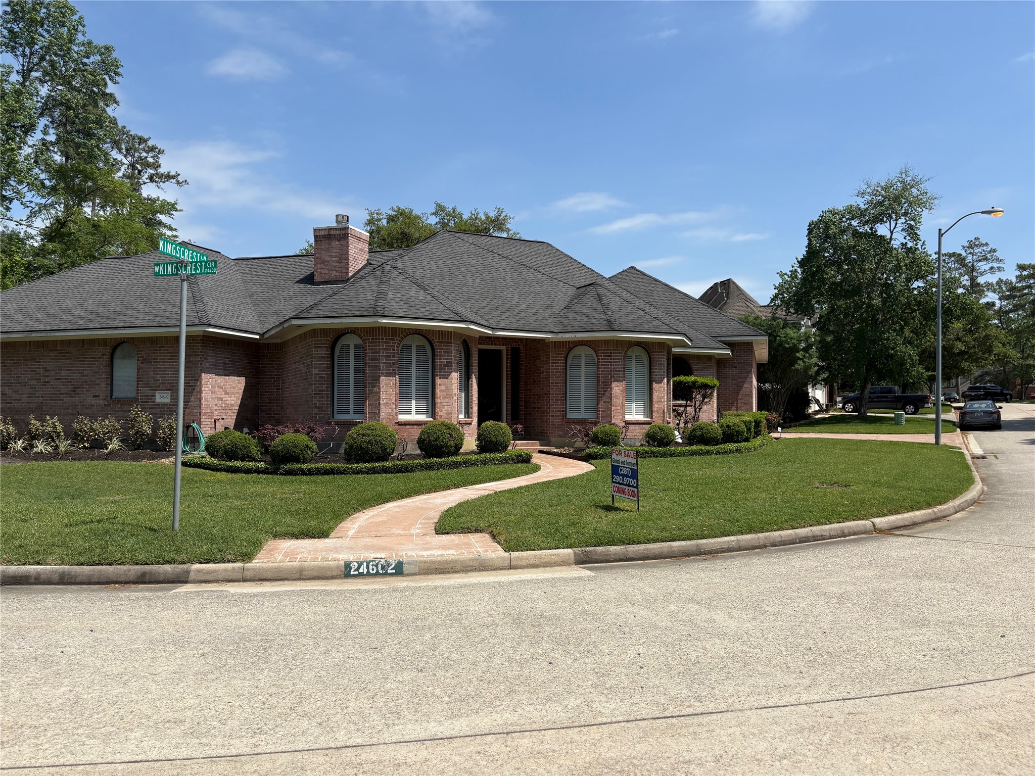 24602 West Kingscrest Circle Spring, TX 77389 - Photo 12 of 15 a front view of a house with a yard