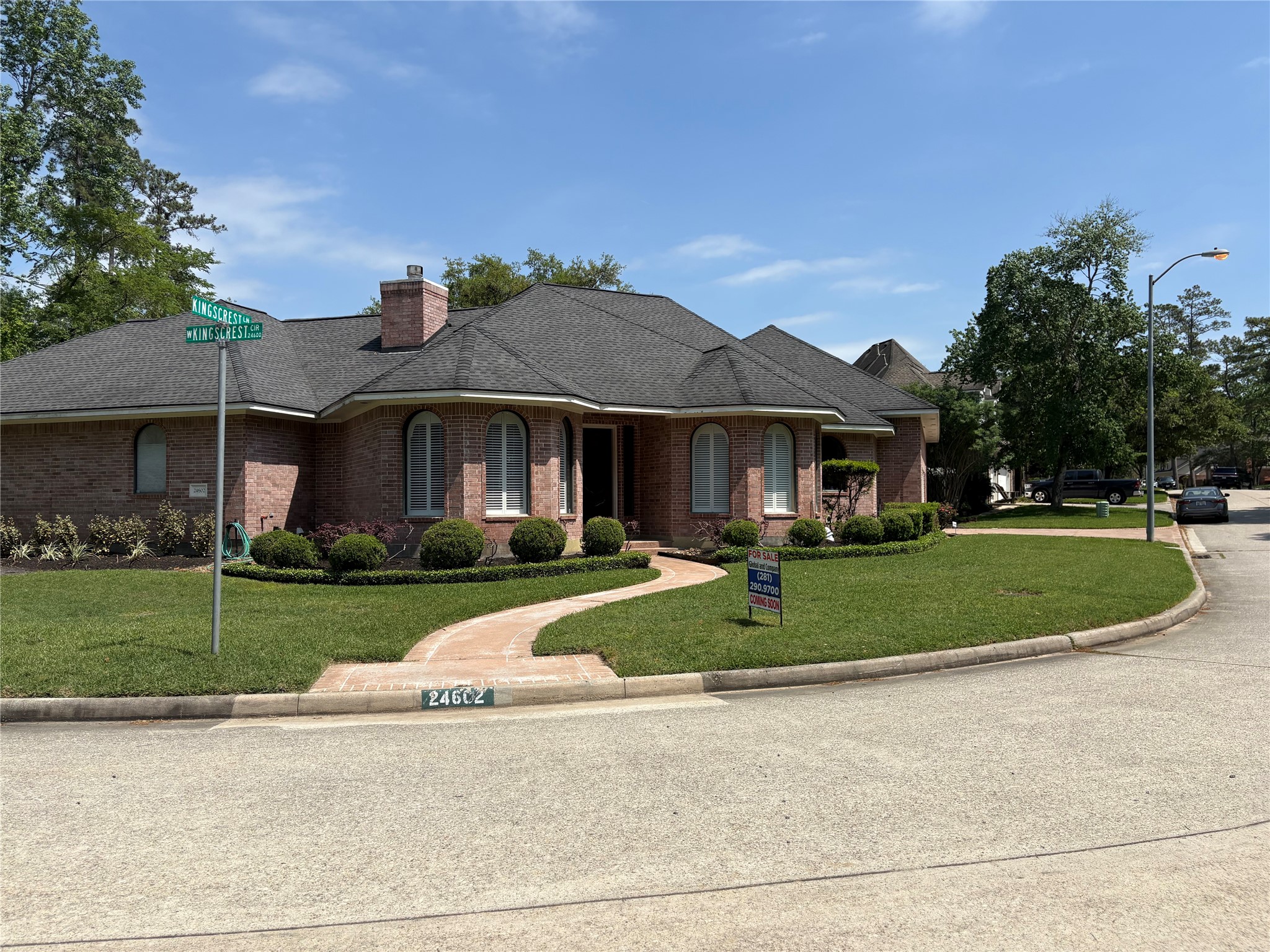 24602 West Kingscrest Circle Spring, TX 77389 - Photo 13 of 15 a front view of a house with a yard
