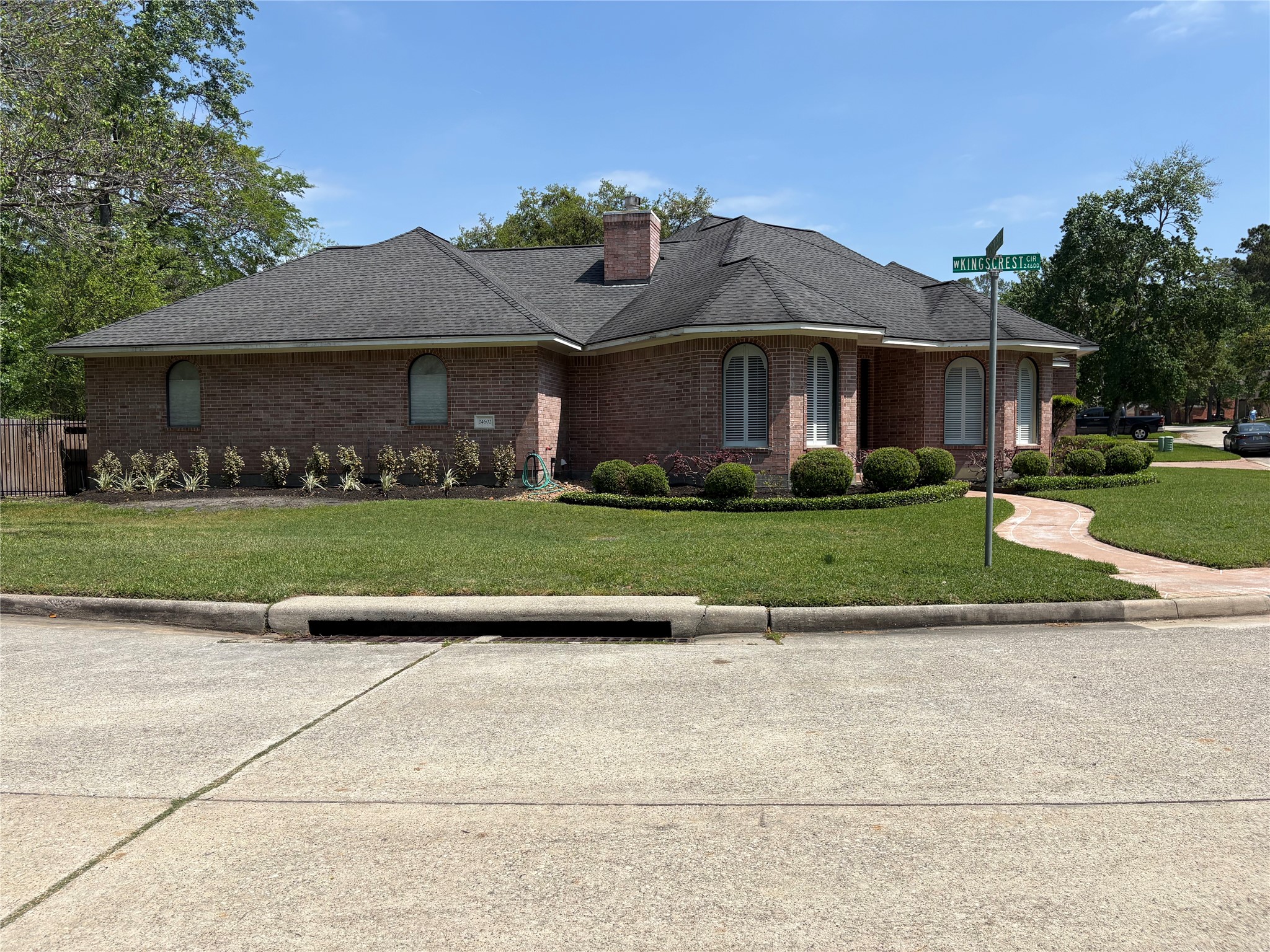 24602 West Kingscrest Circle Spring, TX 77389 - Photo 14 of 15 a front view of a house with a yard