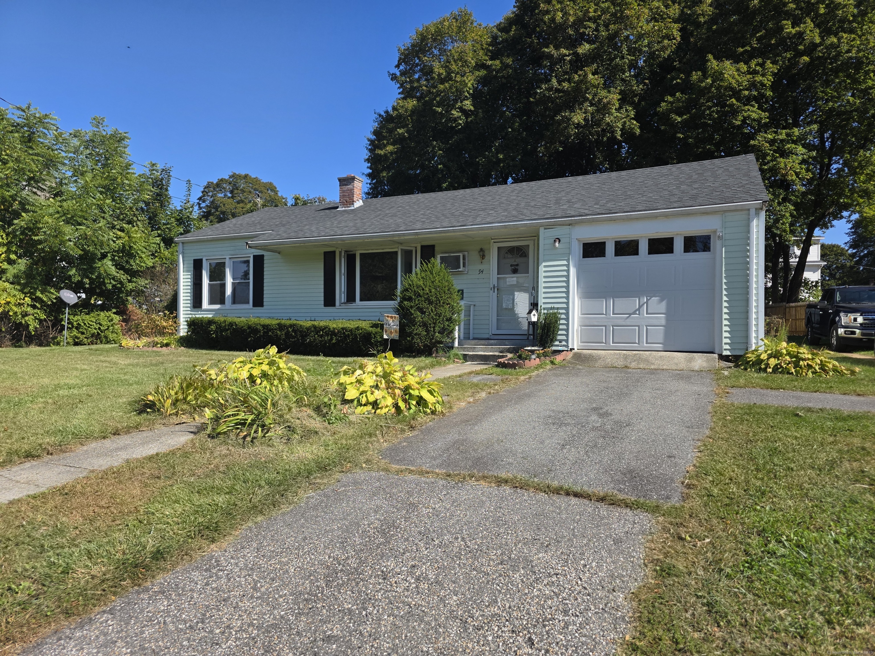 94 Mechanic Street Killingly, CT 06239 - Photo 1 of 1 a front view of a house with garden