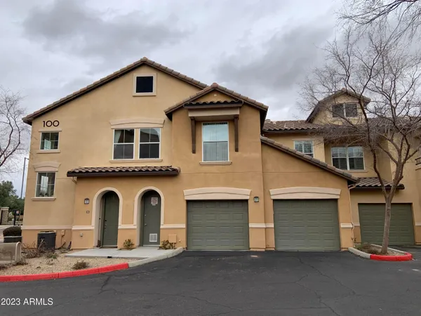 a front view of a house with garage