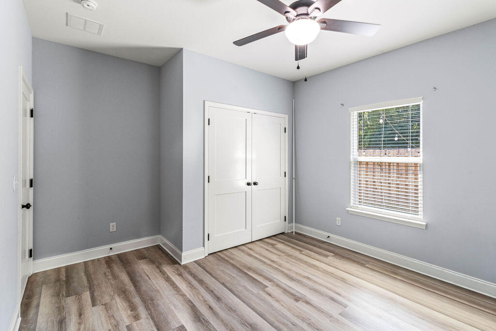 57 5th Street Shalimar, FL 32579 - Photo 16 of 31 a view of an empty room with a window and a dresser