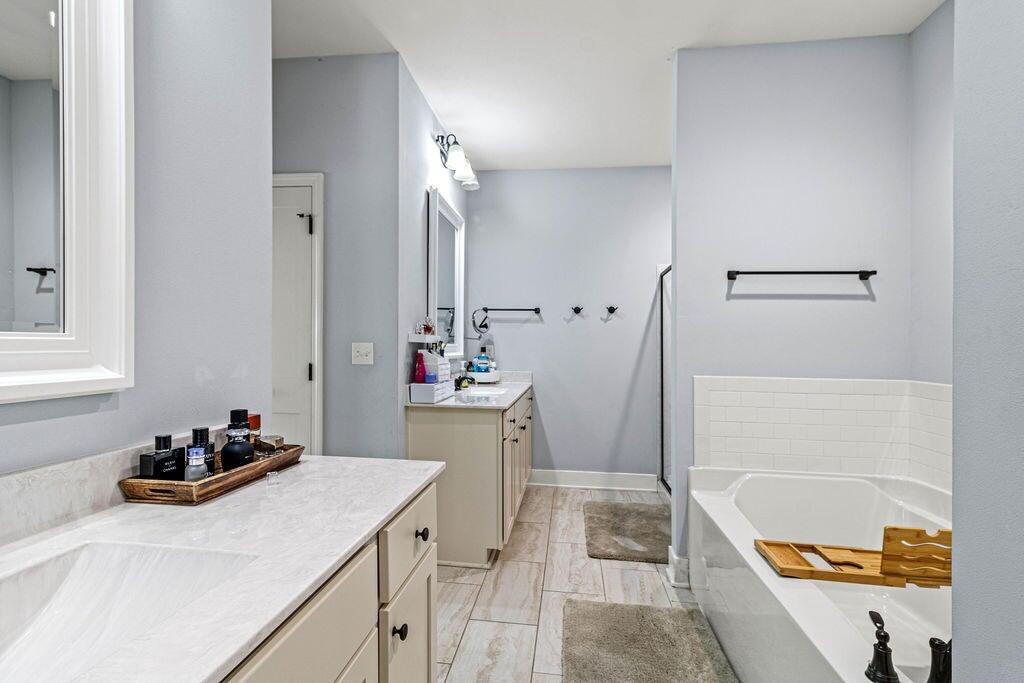 57 5th Street Shalimar, FL 32579 - Photo 22 of 30 a bathroom with a tub sink and mirror