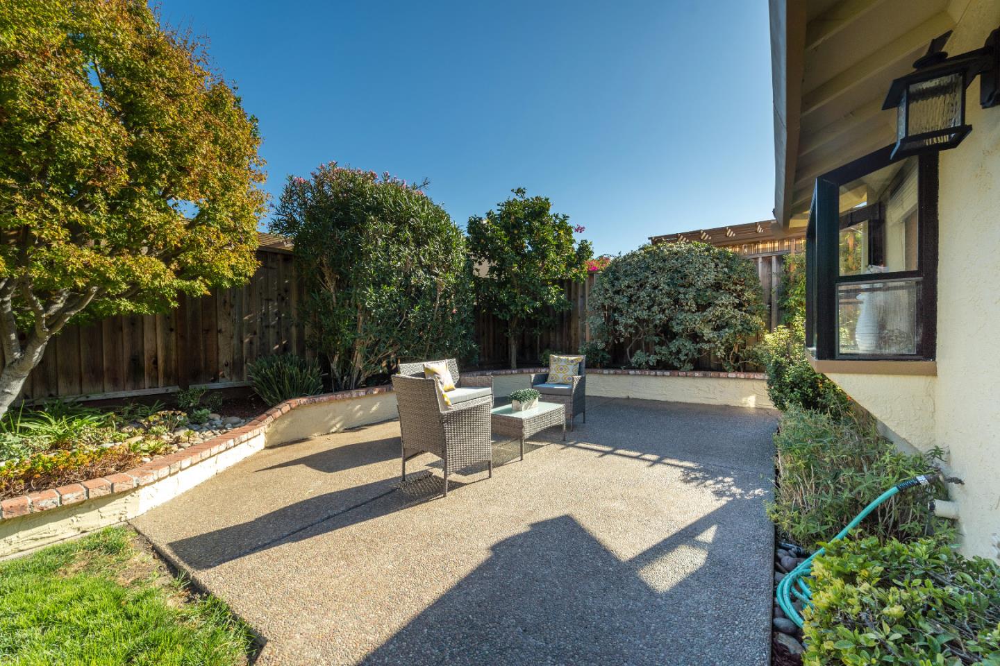 808 Hamilton Avenue Milpitas, CA 95035 - Photo 32 of 41 a view of a backyard with couches plants and wooden fence