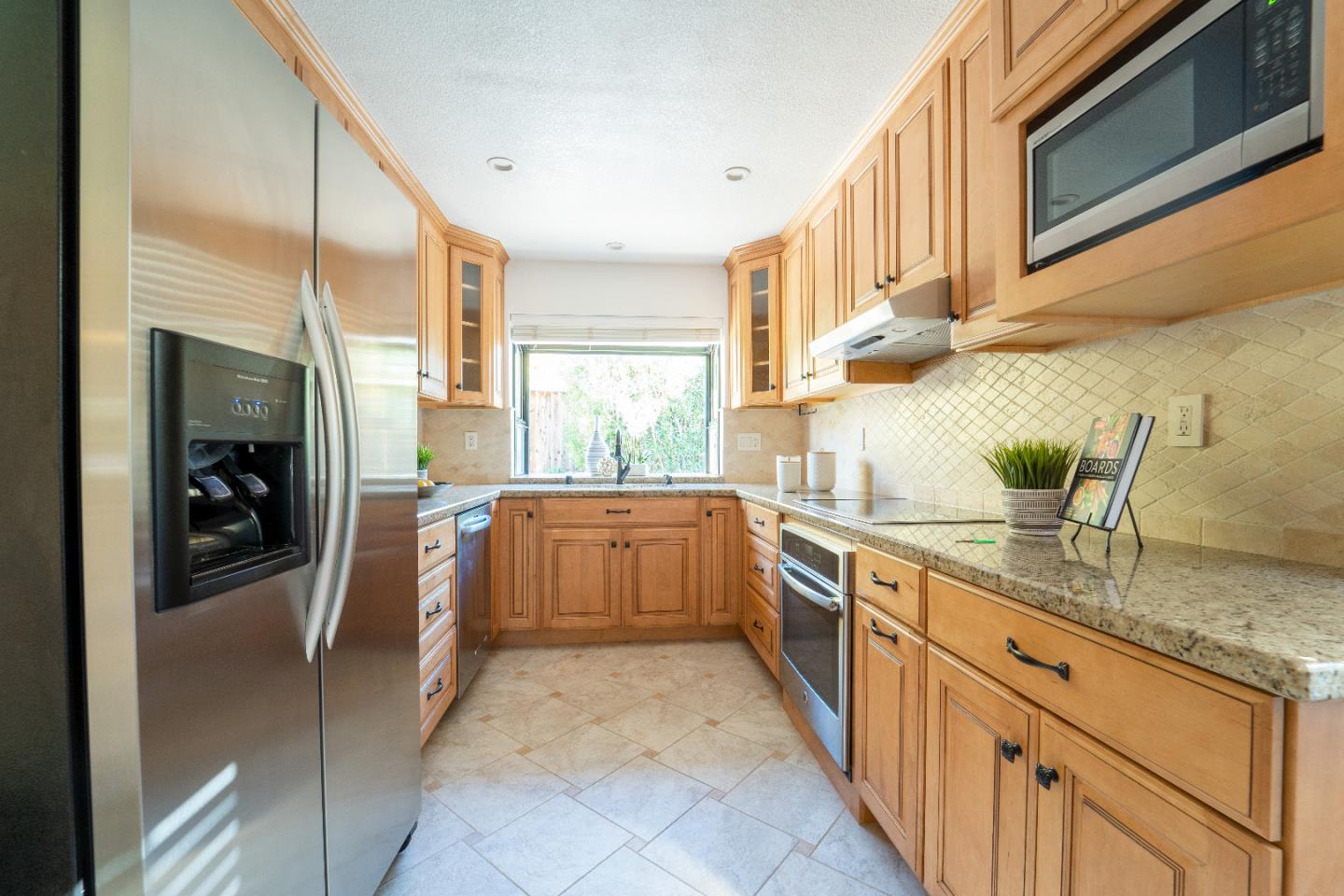 808 Hamilton Avenue Milpitas, CA 95035 - Photo 7 of 41 a kitchen with stainless steel appliances granite countertop a sink and a stove