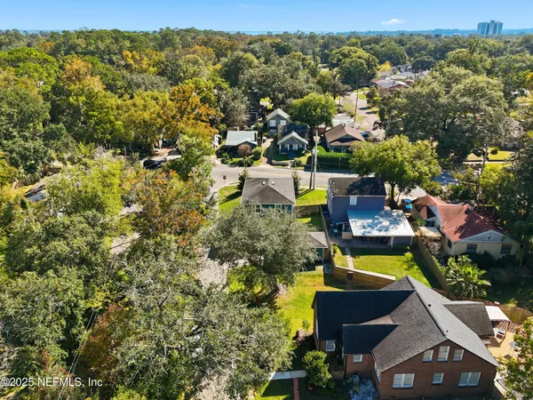 an aerial view of a house with swimming pool