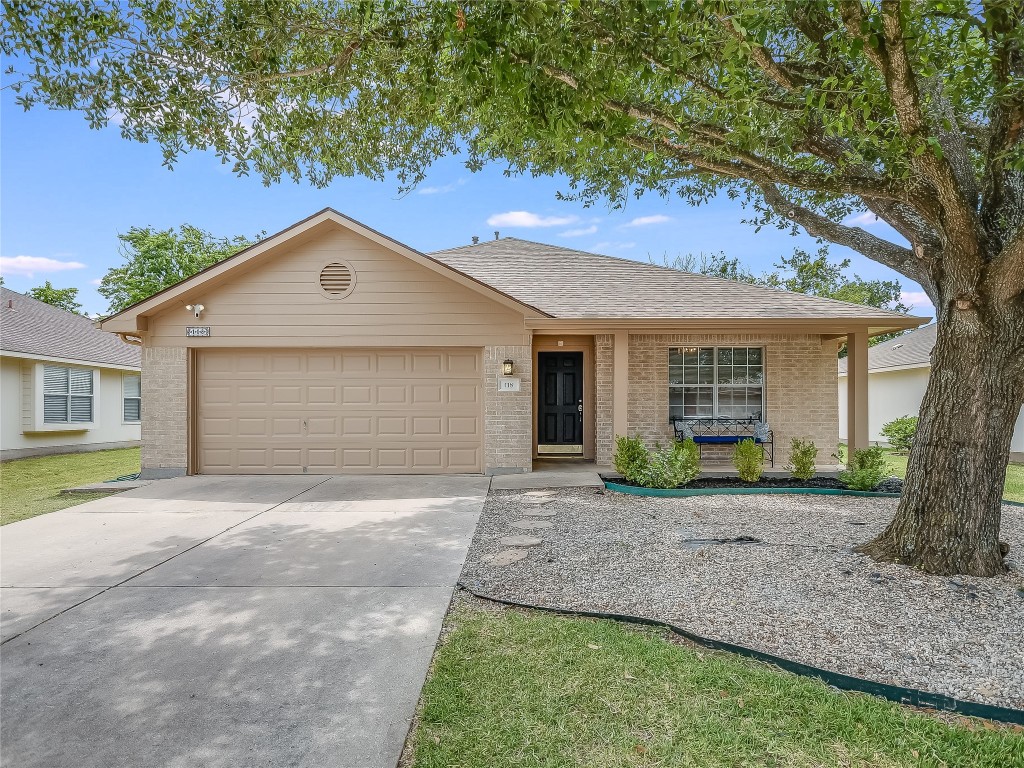 118 Edison Drive Hutto, TX 78634 - Photo 1 of 1 a front view of a house with garden