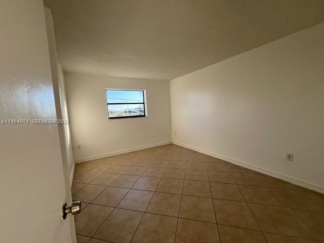 8075 Northwest 7th Street, Unit 501 Miami, FL 33126 - Photo 11 of 28 a view of a hallway with a small space
