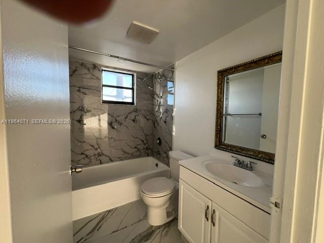8075 Northwest 7th Street, Unit 501 Miami, FL 33126 - Photo 13 of 28 a bathroom with a granite countertop toilet a sink and bathtub