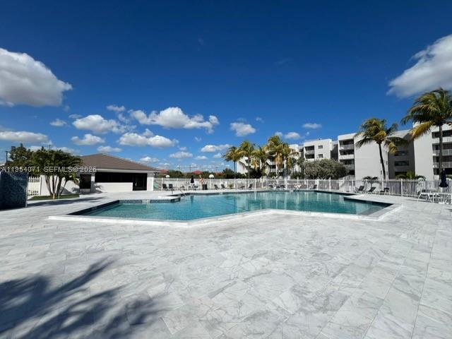 8075 Northwest 7th Street, Unit 501 Miami, FL 33126 - Photo 23 of 28 a view of swimming pool and outdoor seating