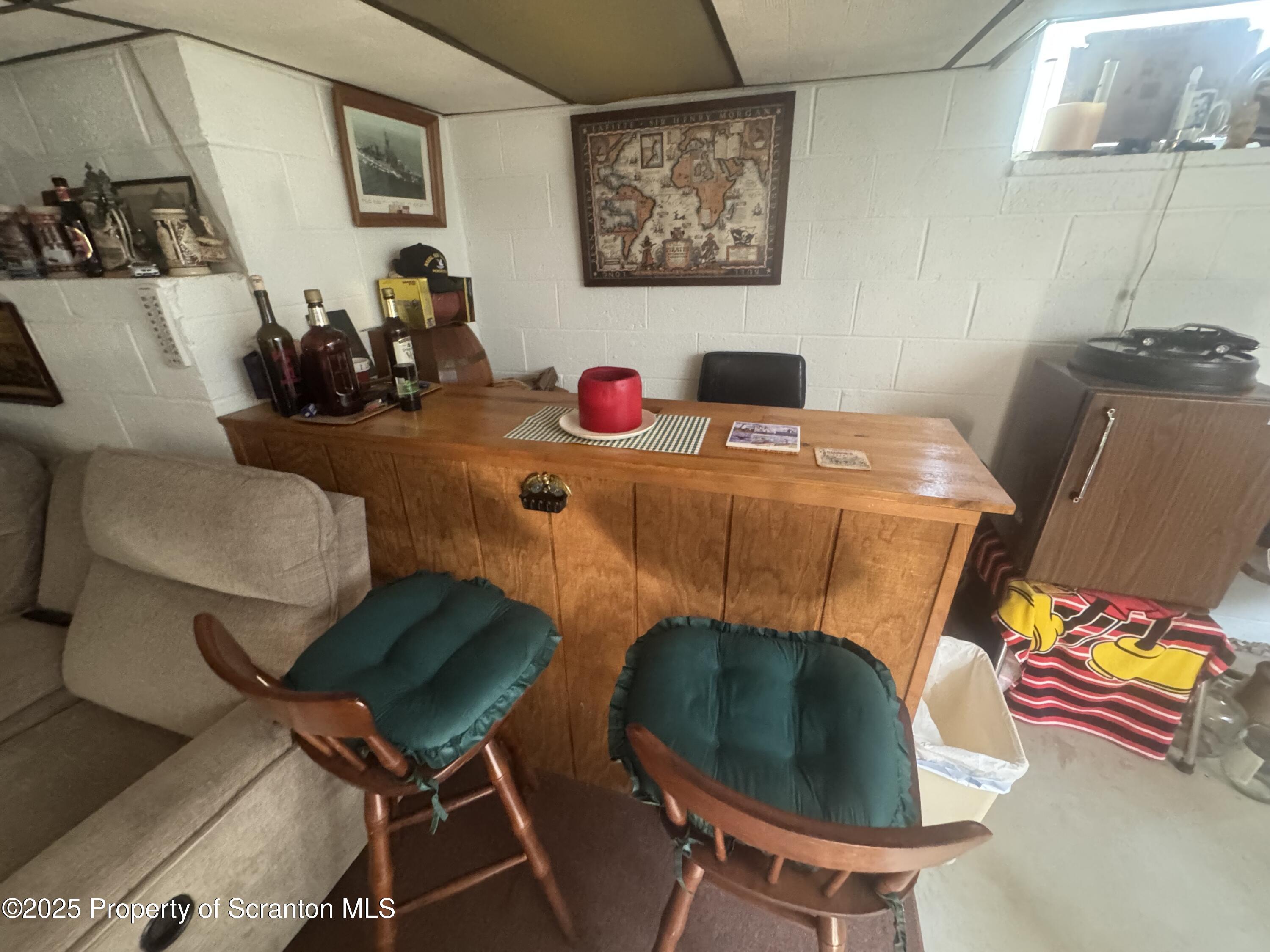 464 Point Road Lake Winola, PA 18419 - Photo 19 of 47 a bedroom with furniture and a chair