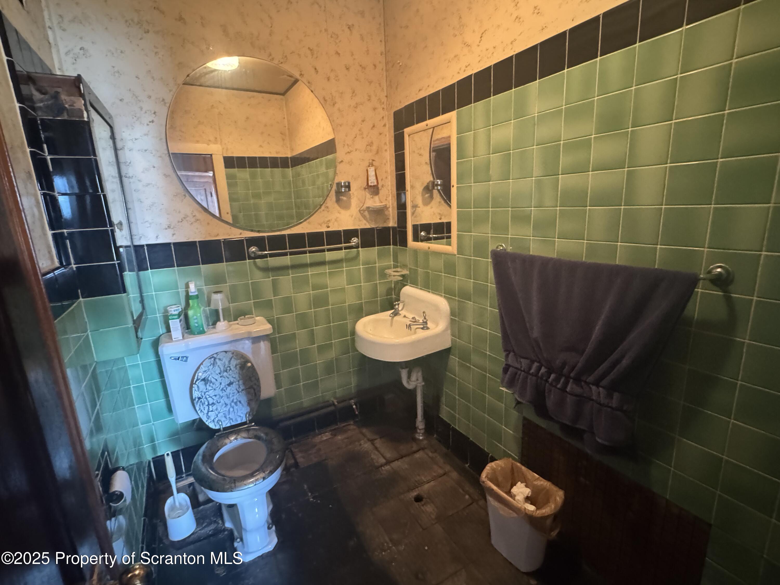 464 Point Road Lake Winola, PA 18419 - Photo 22 of 47 a bathroom with a sink toilet and a mirror