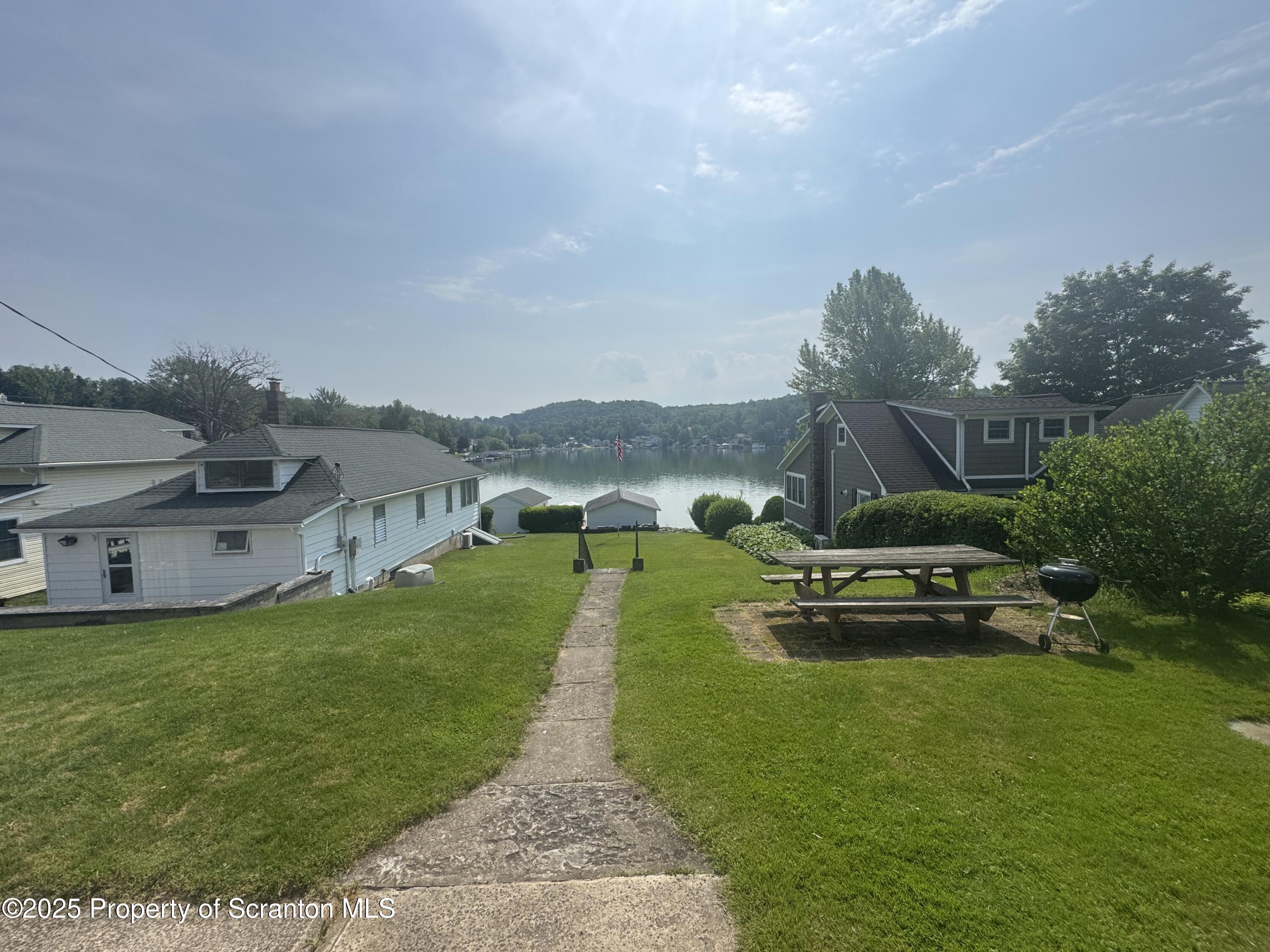 464 Point Road Lake Winola, PA 18419 - Photo 26 of 47 a view of a garden with houses
