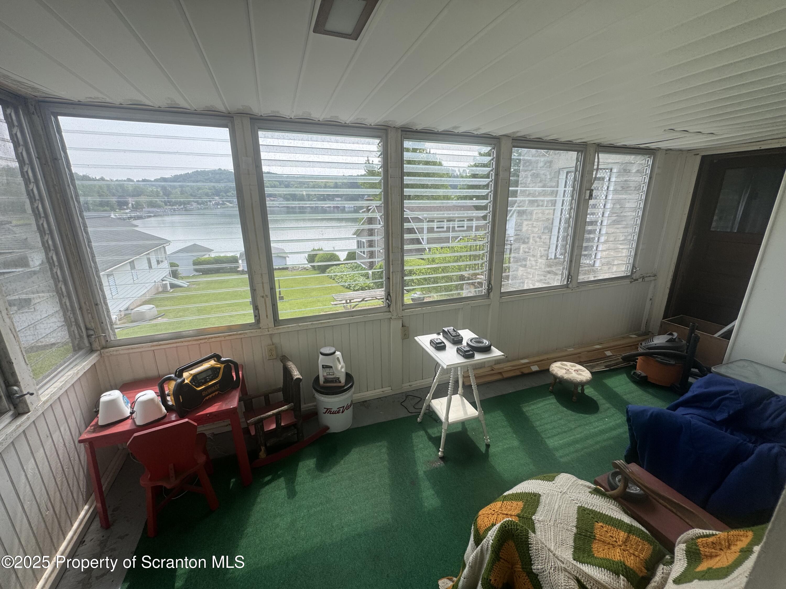 464 Point Road Lake Winola, PA 18419 - Photo 29 of 47 a living room with furniture and a window