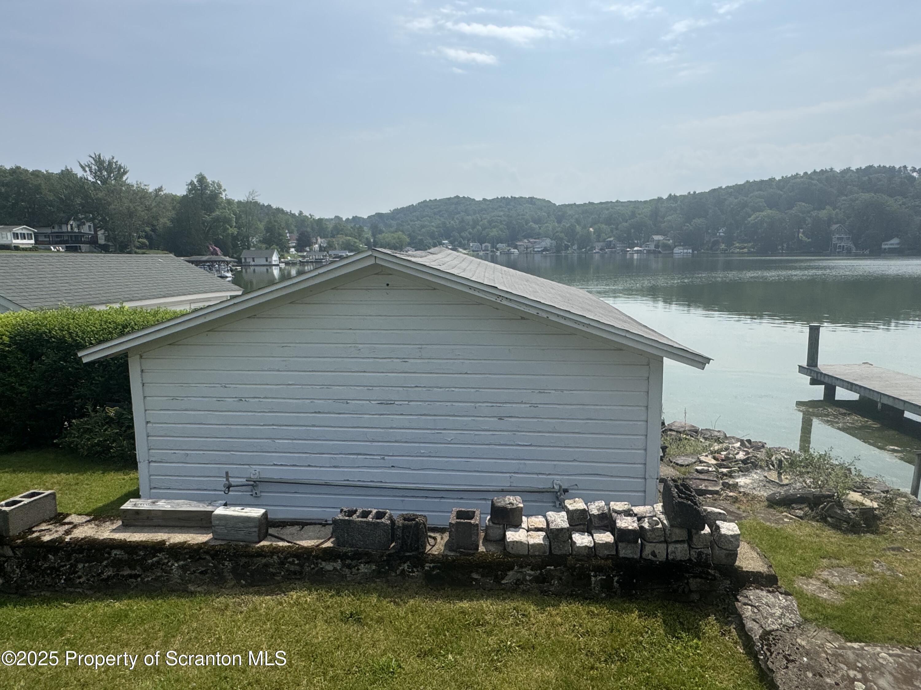 464 Point Road Lake Winola, PA 18419 - Photo 34 of 47 a backyard of a house with lots of green space