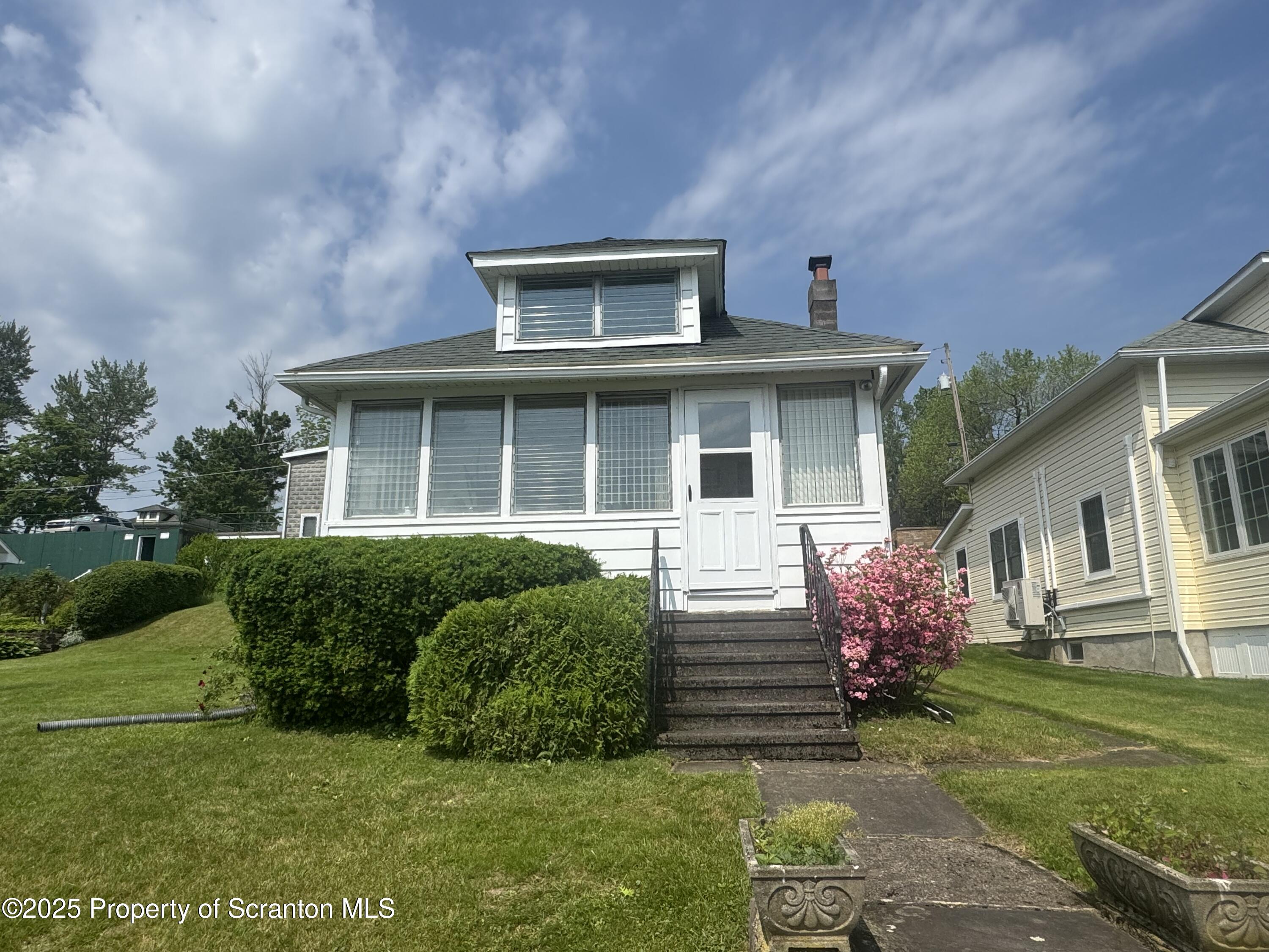 464 Point Road Lake Winola, PA 18419 - Photo 38 of 47 a front view of a house with a yard