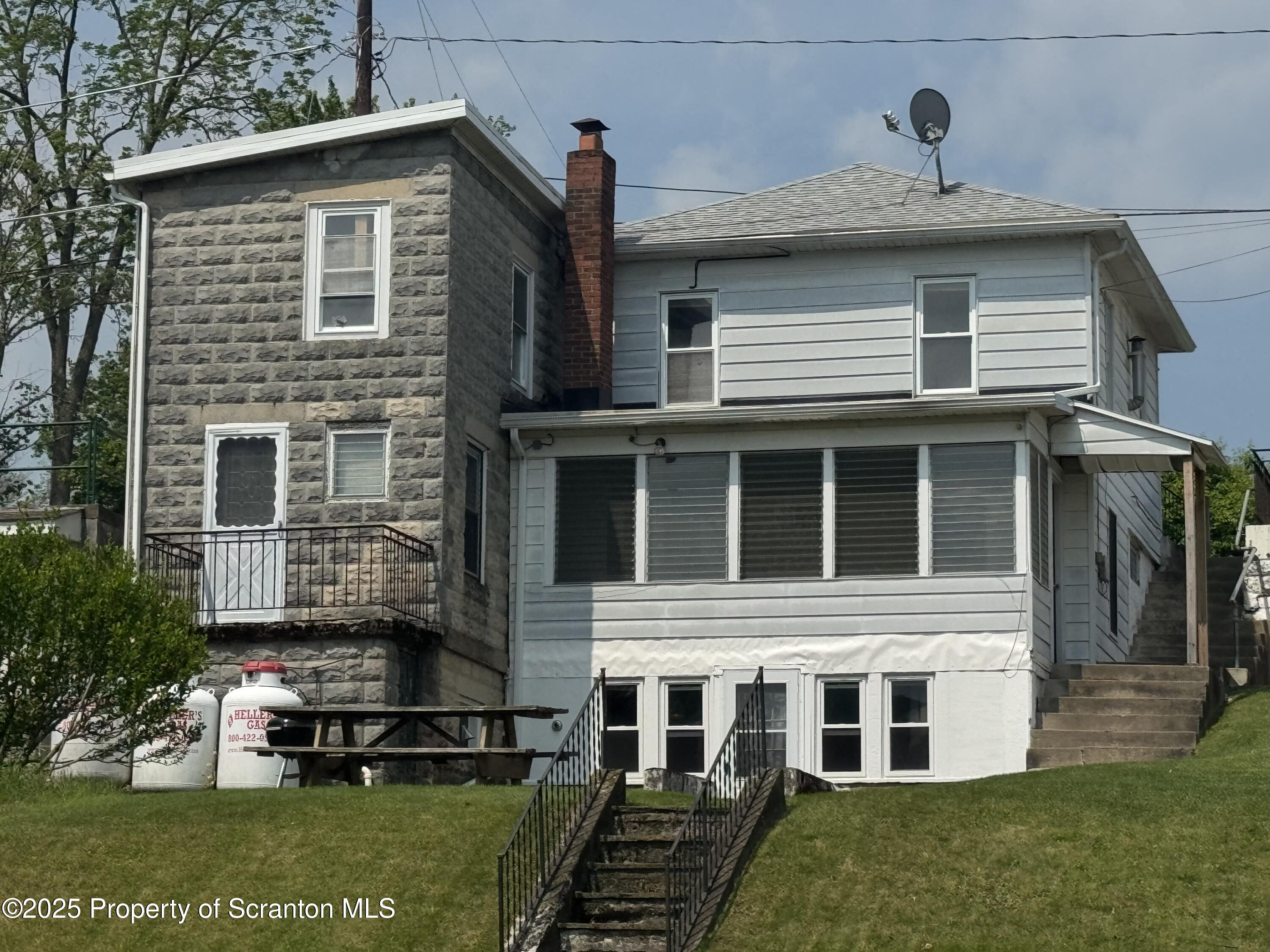 464 Point Road Lake Winola, PA 18419 - Photo 39 of 47 a front view of a house with a yard