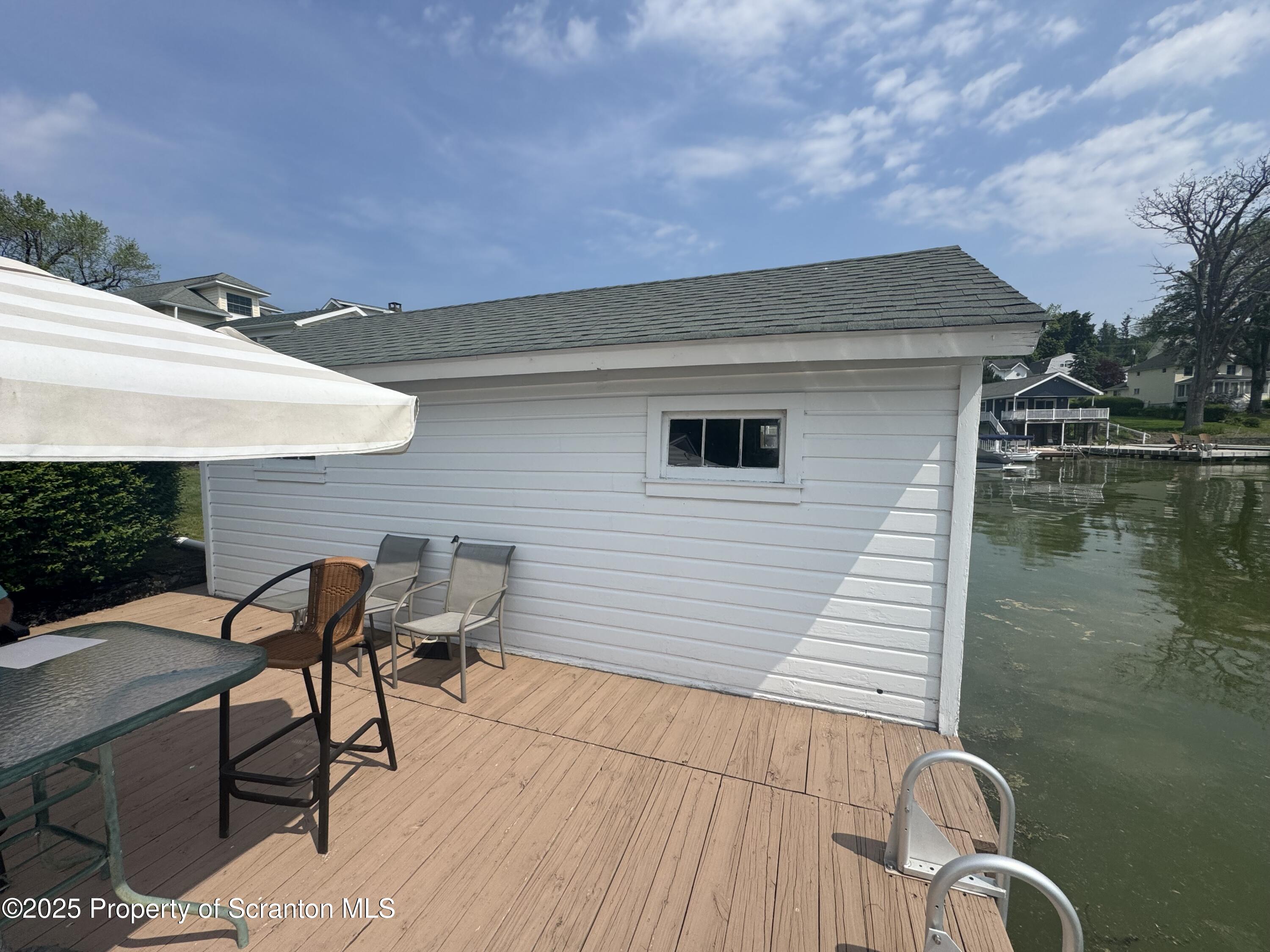 464 Point Road Lake Winola, PA 18419 - Photo 42 of 47 a backyard of a house with table and chairs