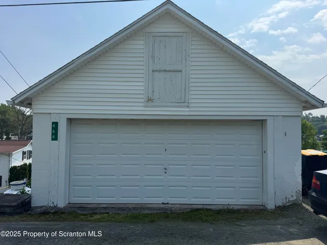 a front view of a house with a garage