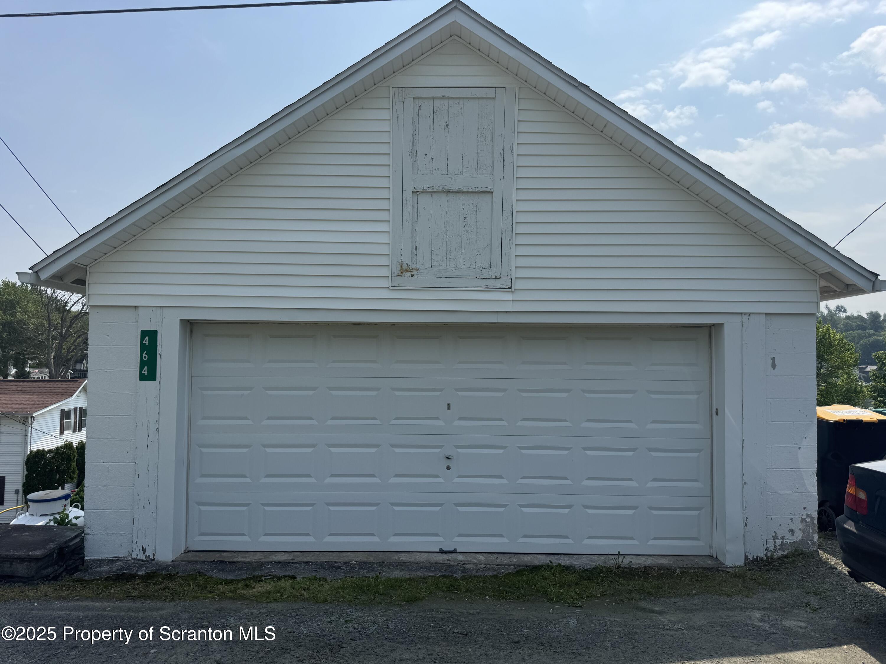 464 Point Road Lake Winola, PA 18419 - Photo 6 of 47 a front view of a house with a garage