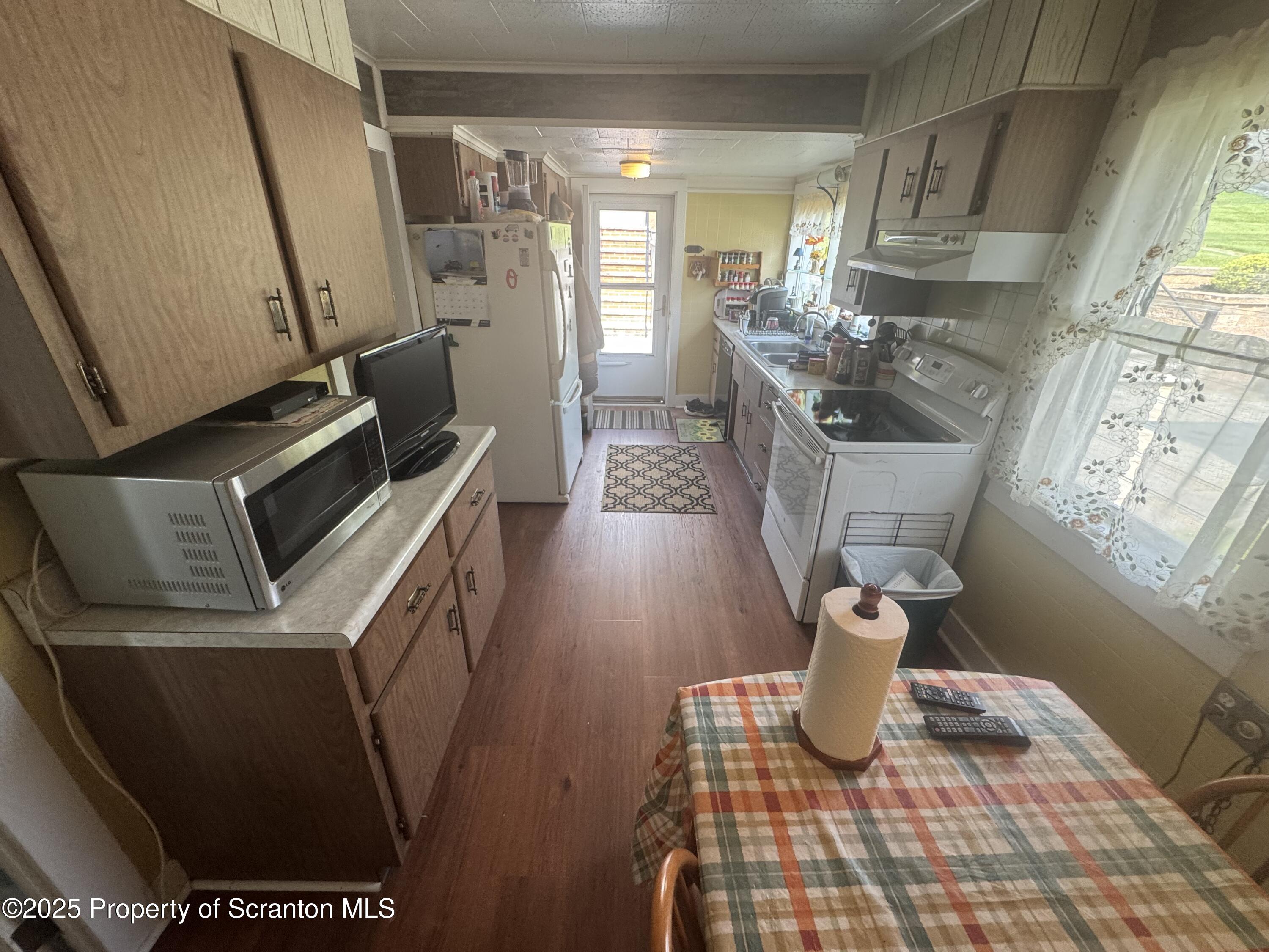464 Point Road Lake Winola, PA 18419 - Photo 9 of 47 a kitchen with a sink and a stove