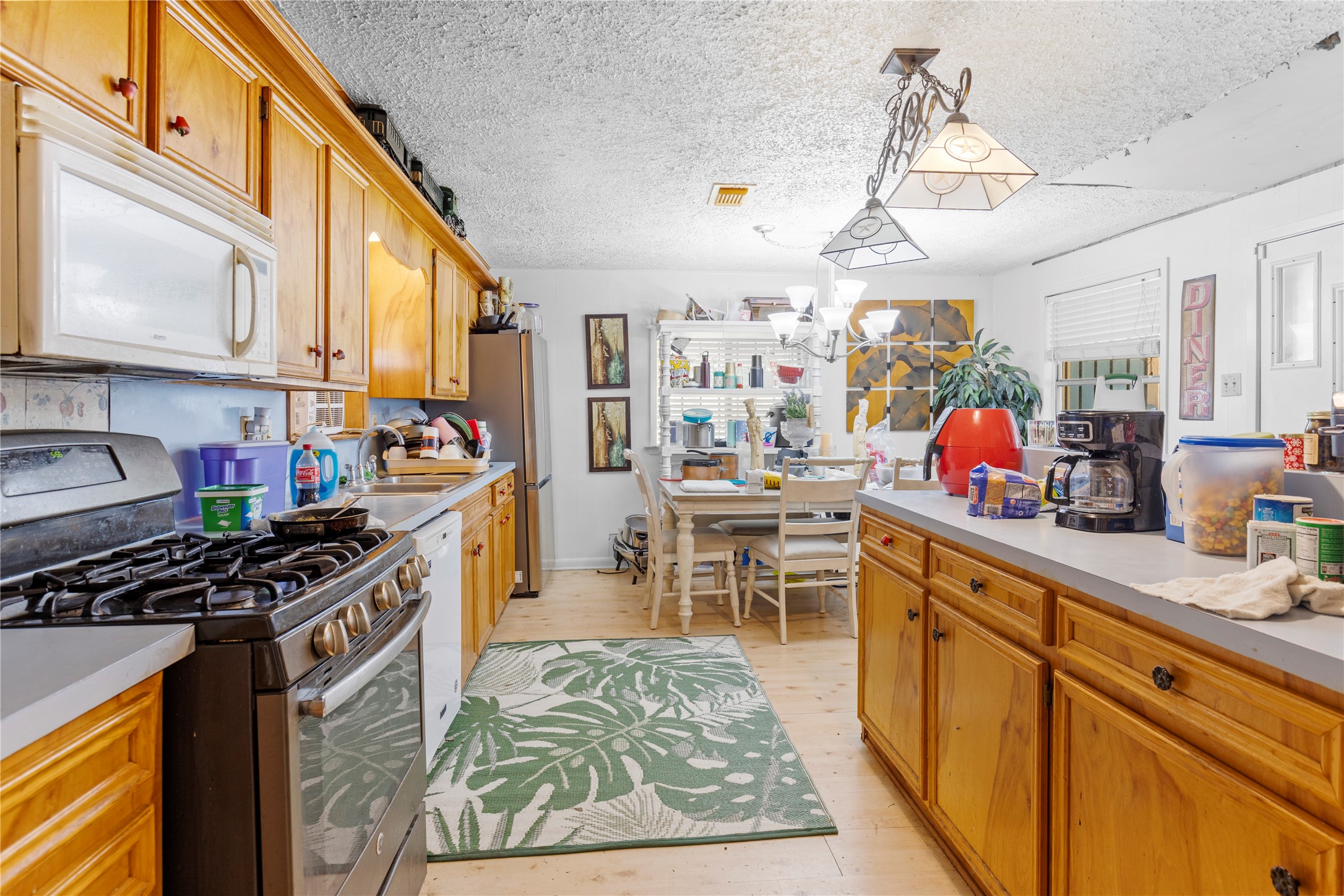 11281 Highway 150 Shepherd, TX 77371 - Photo 11 of 39 a kitchen that has a lot of cabinets in it