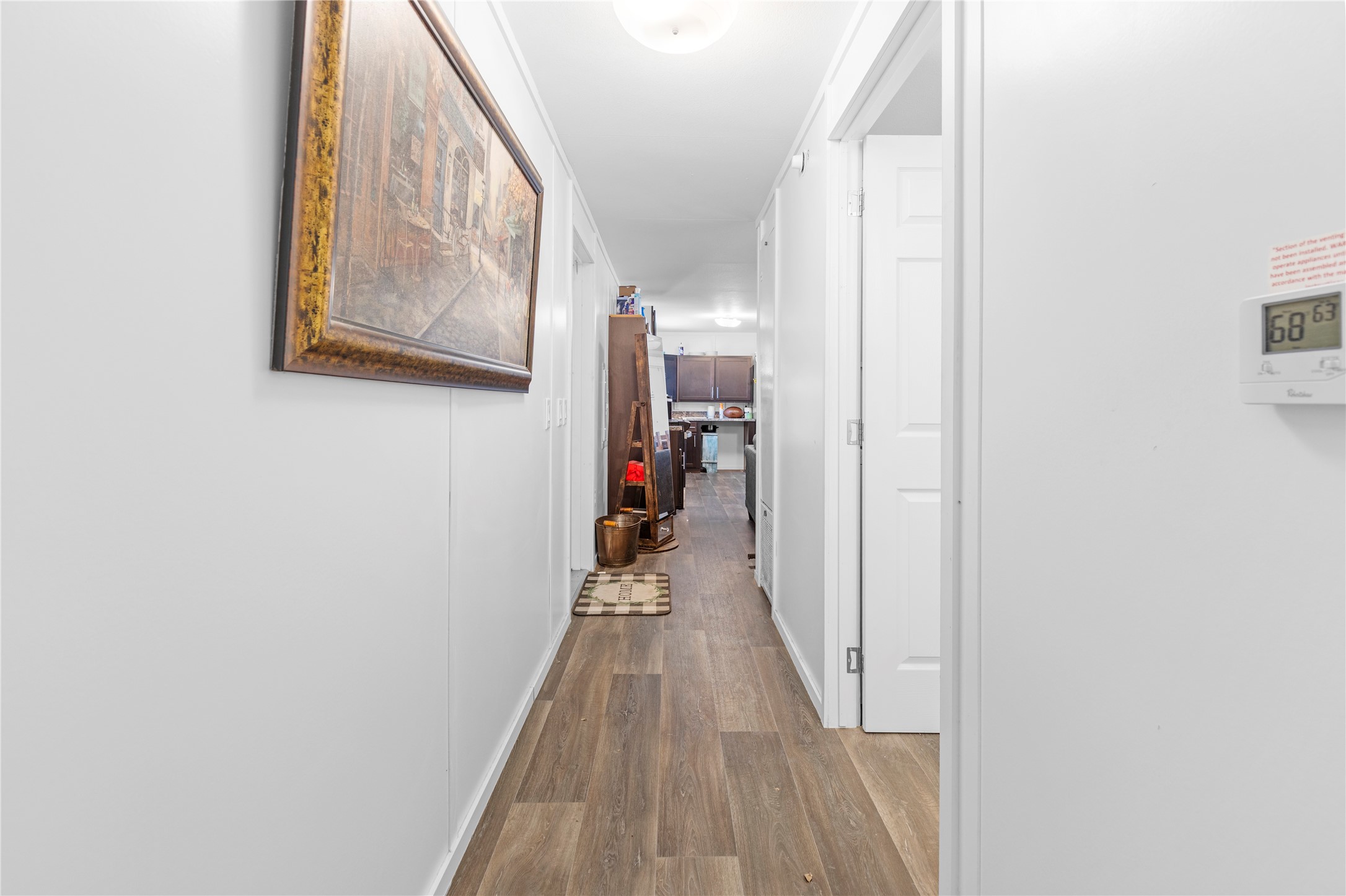 11281 Highway 150 Shepherd, TX 77371 - Photo 34 of 39 a view of a hallway with wooden floor and closet